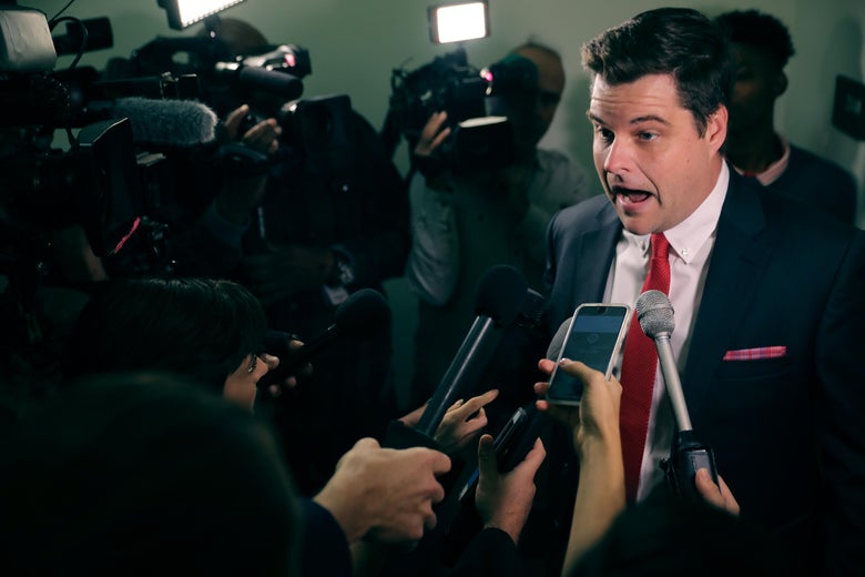 Matt Gaetz speaking to reporters, looking agitated.
